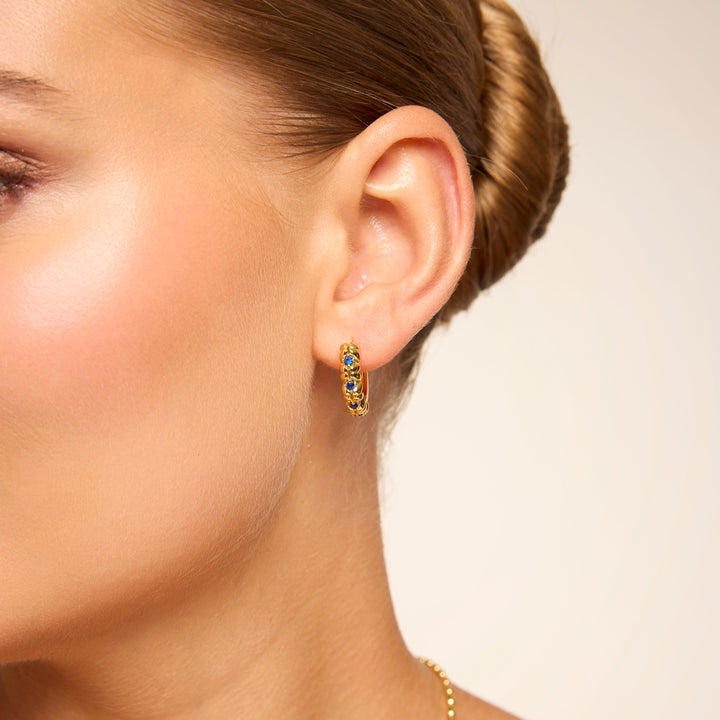 Amelia Blue Huggie in Gold