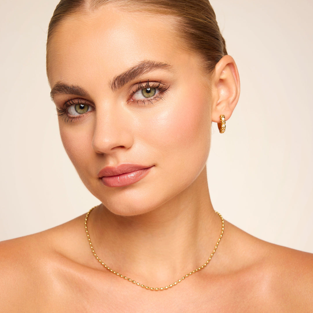 Amelia White Huggie in Gold