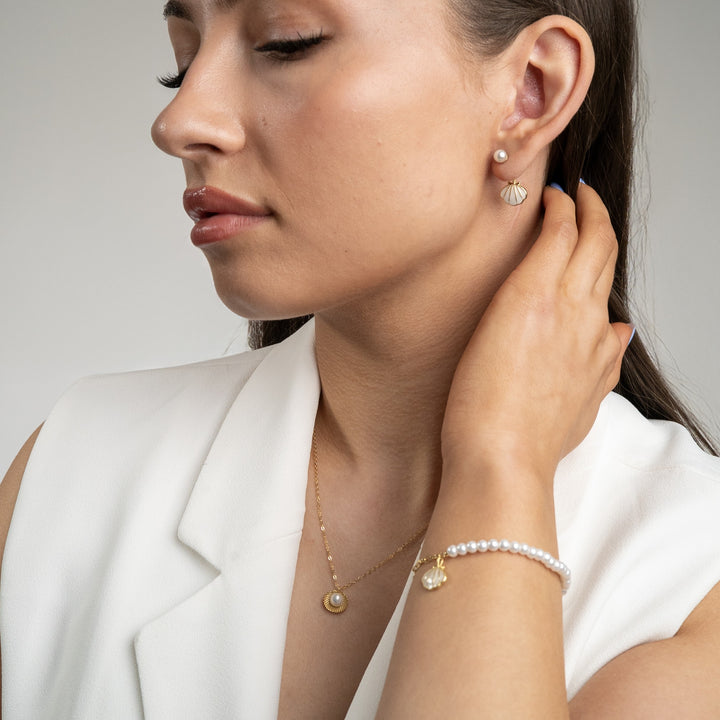 Open shell and pearl necklace