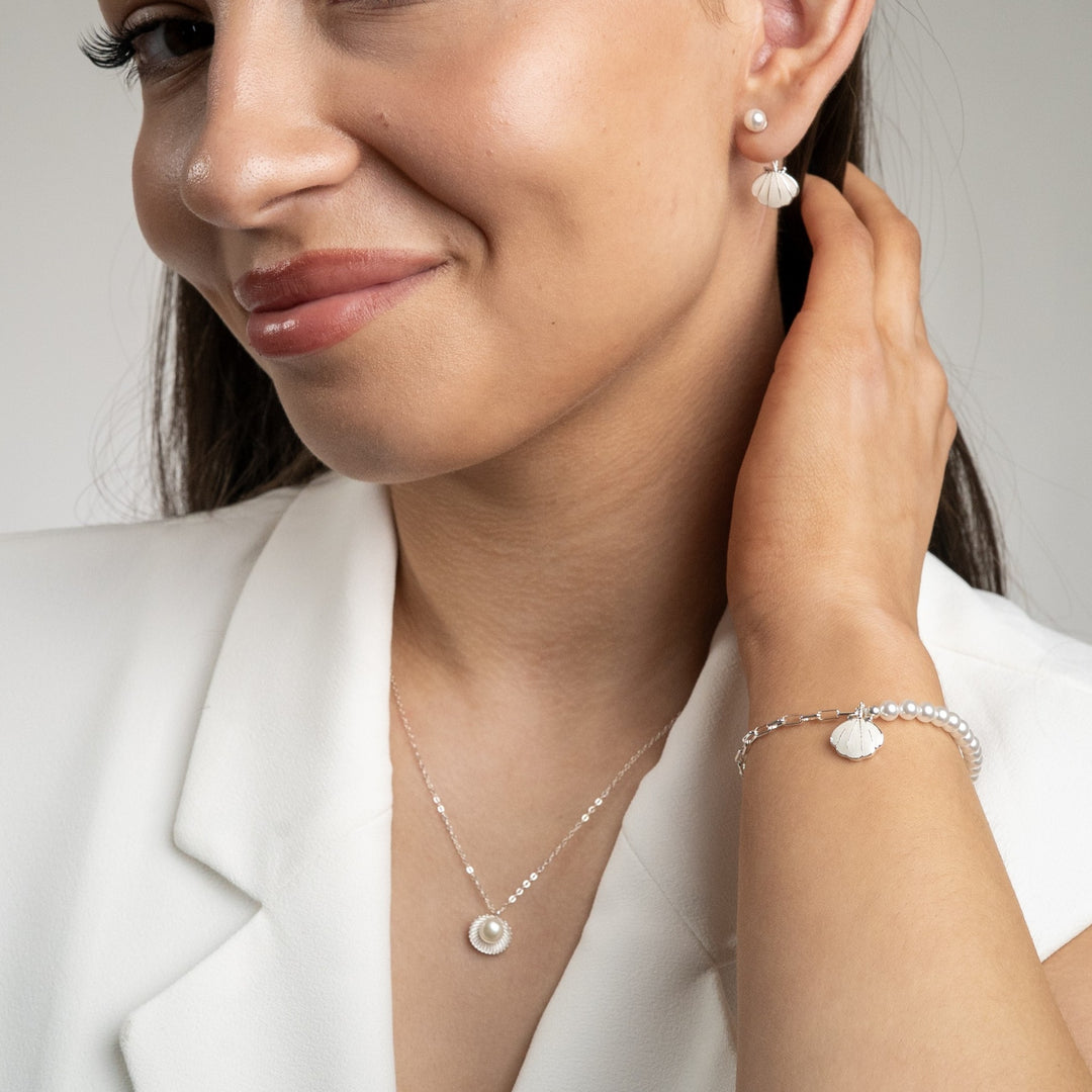 Open shell and pearl necklace