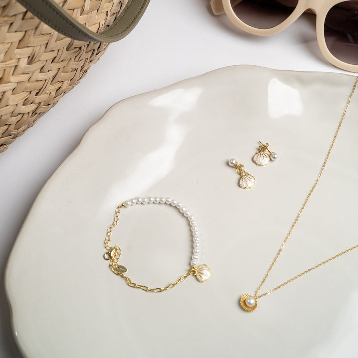 Open shell and pearl necklace