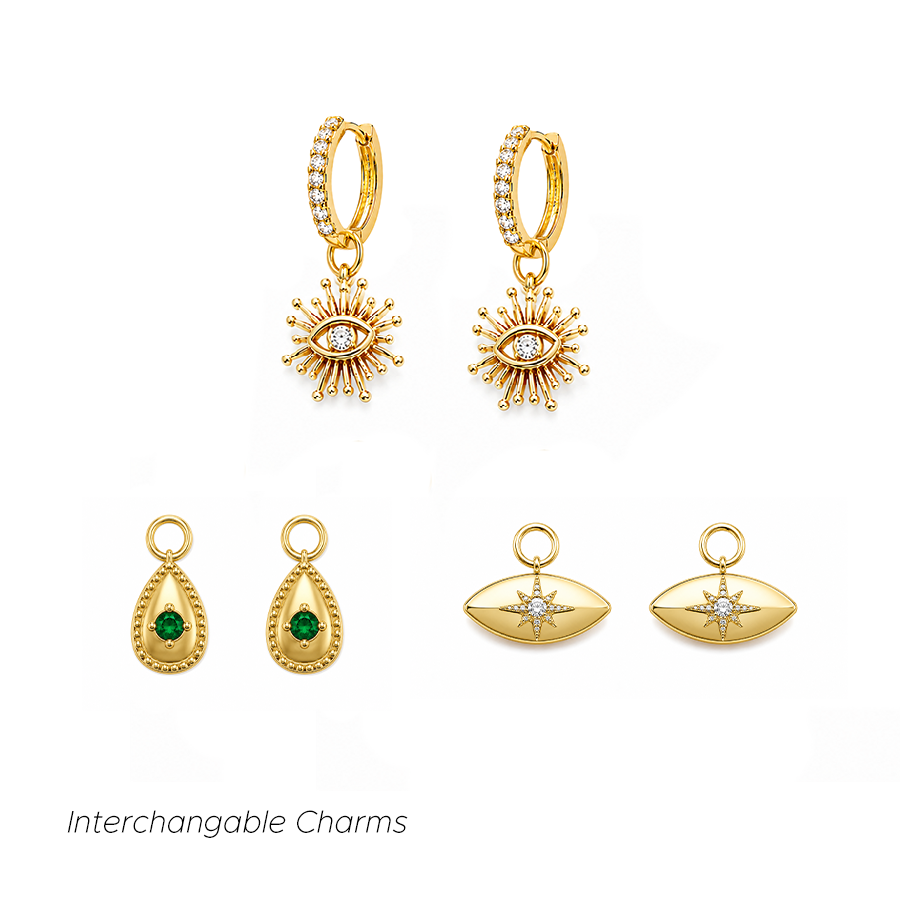 Dakota Charm Earrings Gold interchangeable huggie earring set featuring evil eye charms, green gemstone teardrop charms and celestial eye charms.