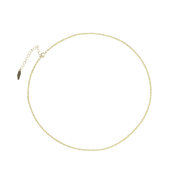 Gold chain necklace on a white background